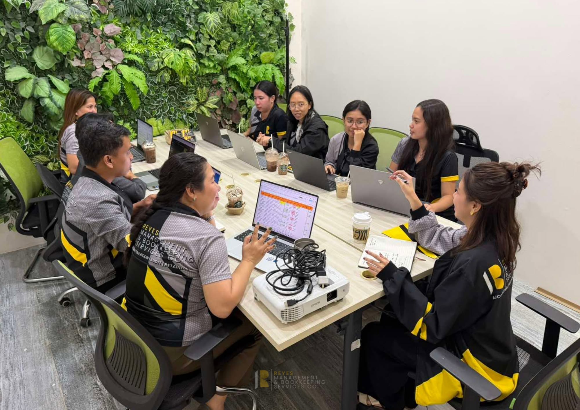 The Reyes Management & Bookkeeping Services team in a client meeting